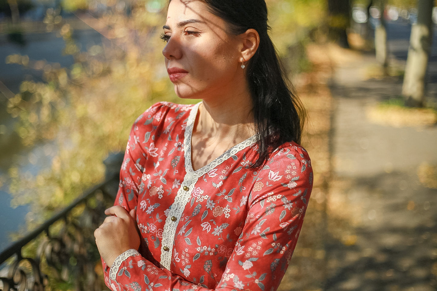 Woman in modest nursing red floral dress outdoors
