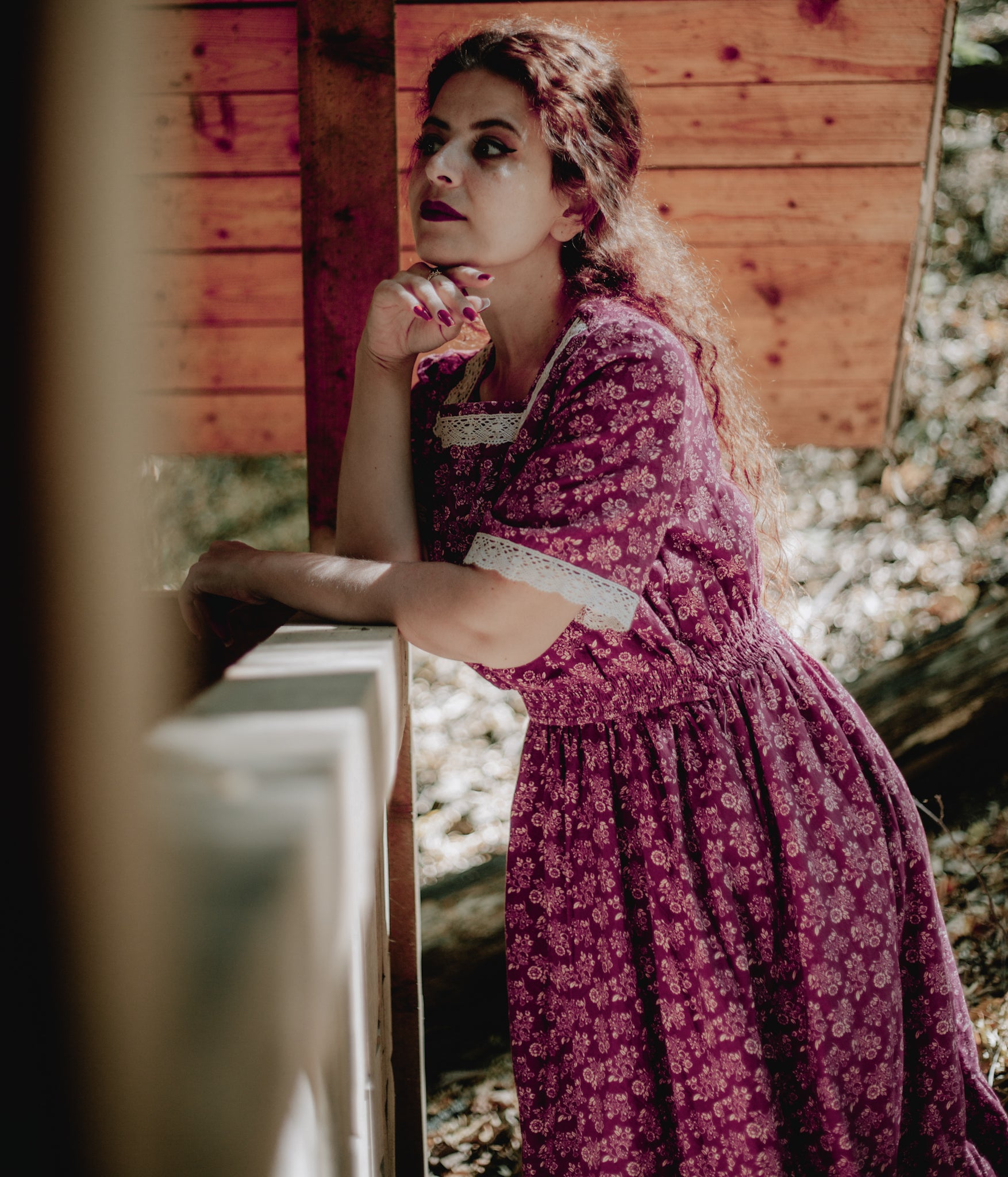 Woman in modest purple nursing dress outdoors