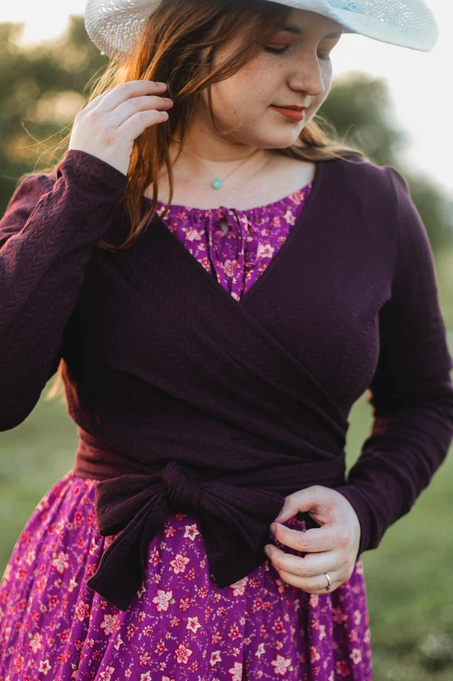 Woman in modest nursing wrap and floral skirt