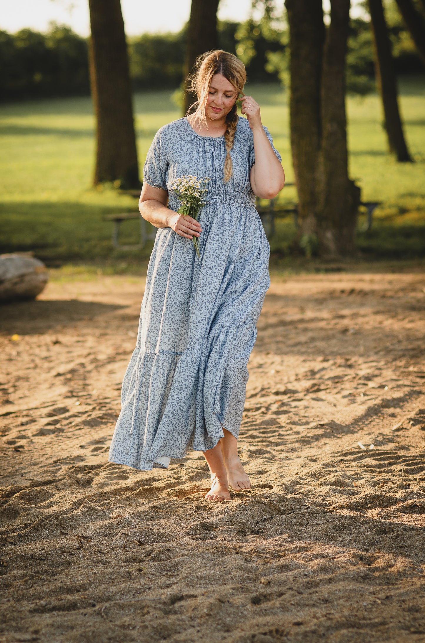 woman in a modest blue nursing dress