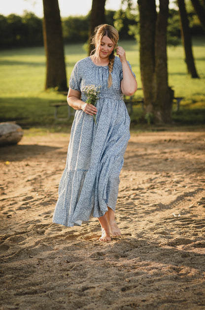 woman in a modest blue nursing dress