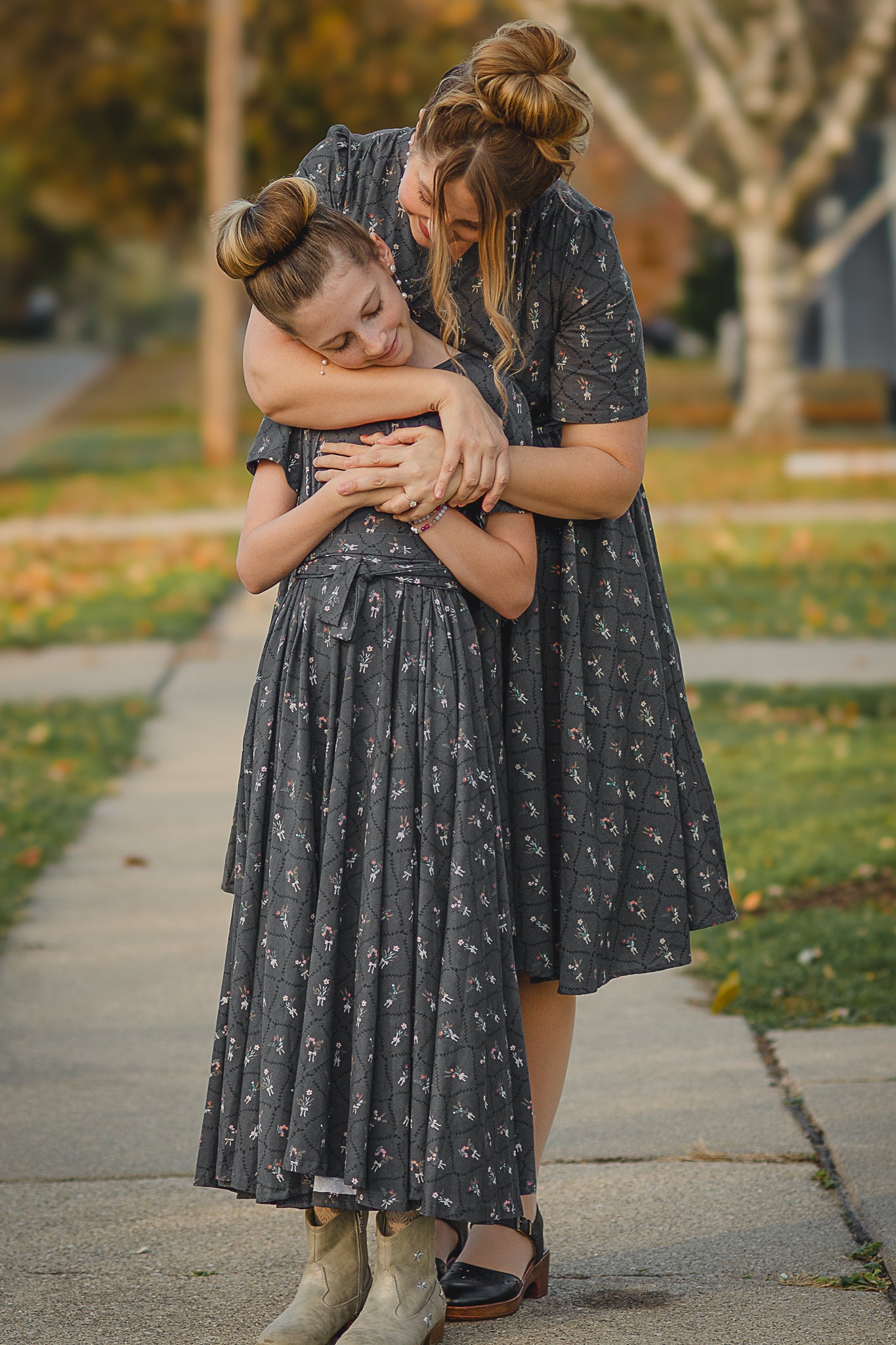 Modest nursing dress woman with modest child hugging