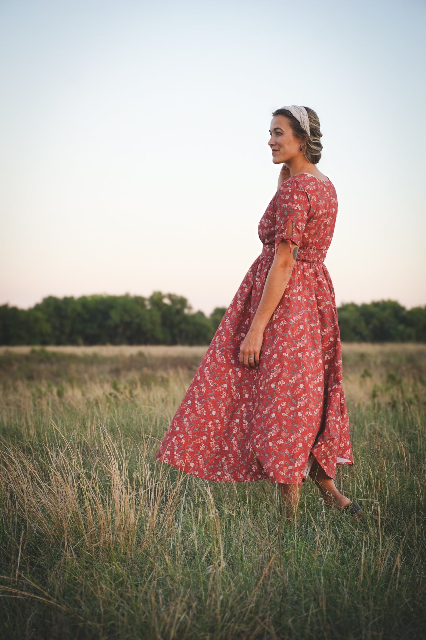 Woman in modest nursing red floral dress outdoors