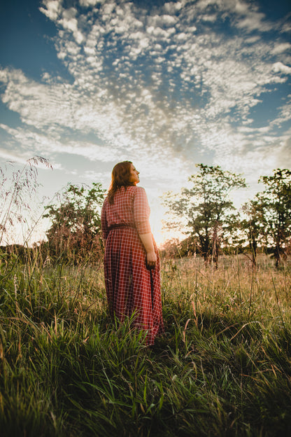 Woman in modest nursing copper windowpane dress