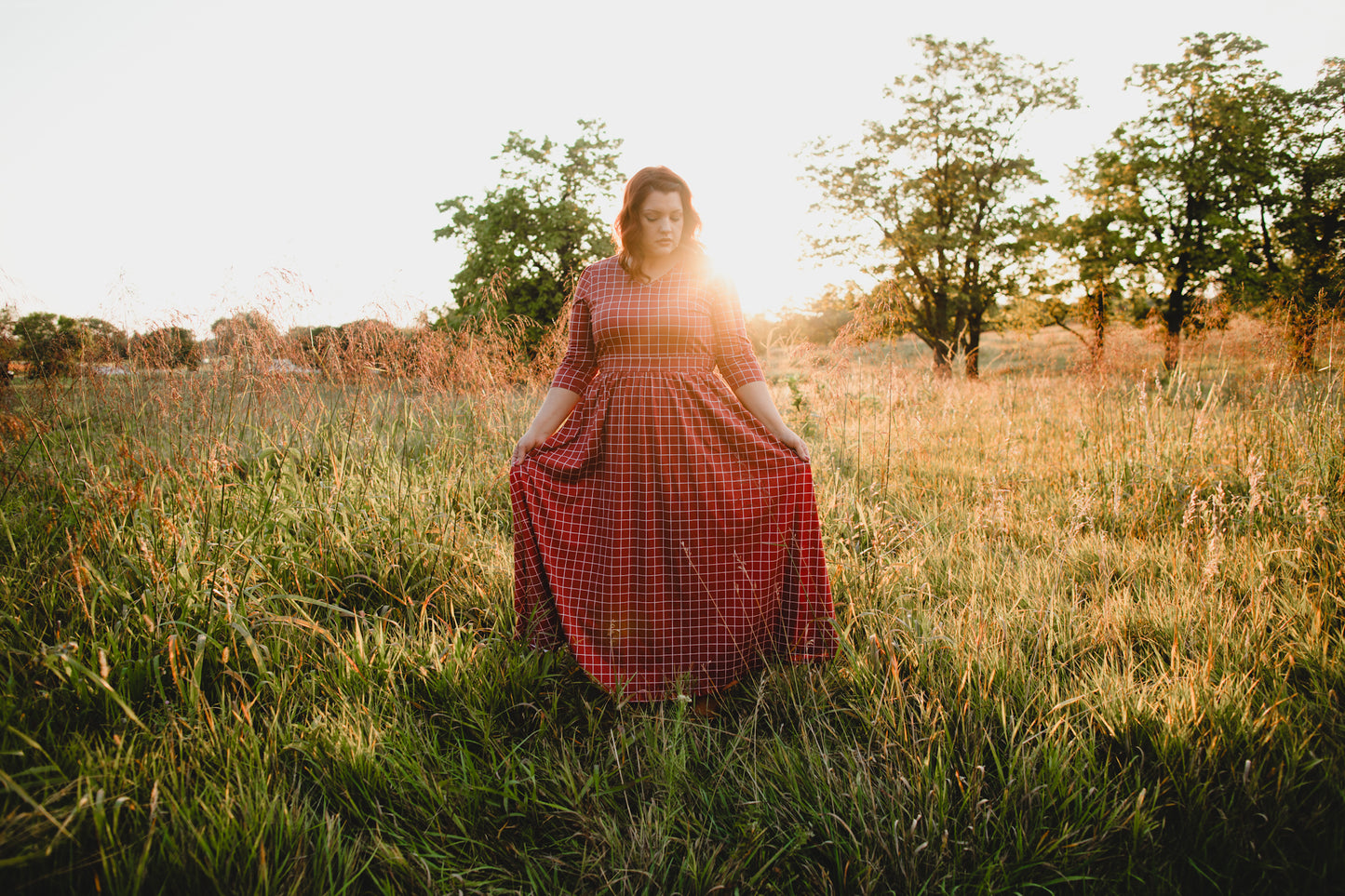 Woman in modest nursing copper windowpane maxi dress outdoors