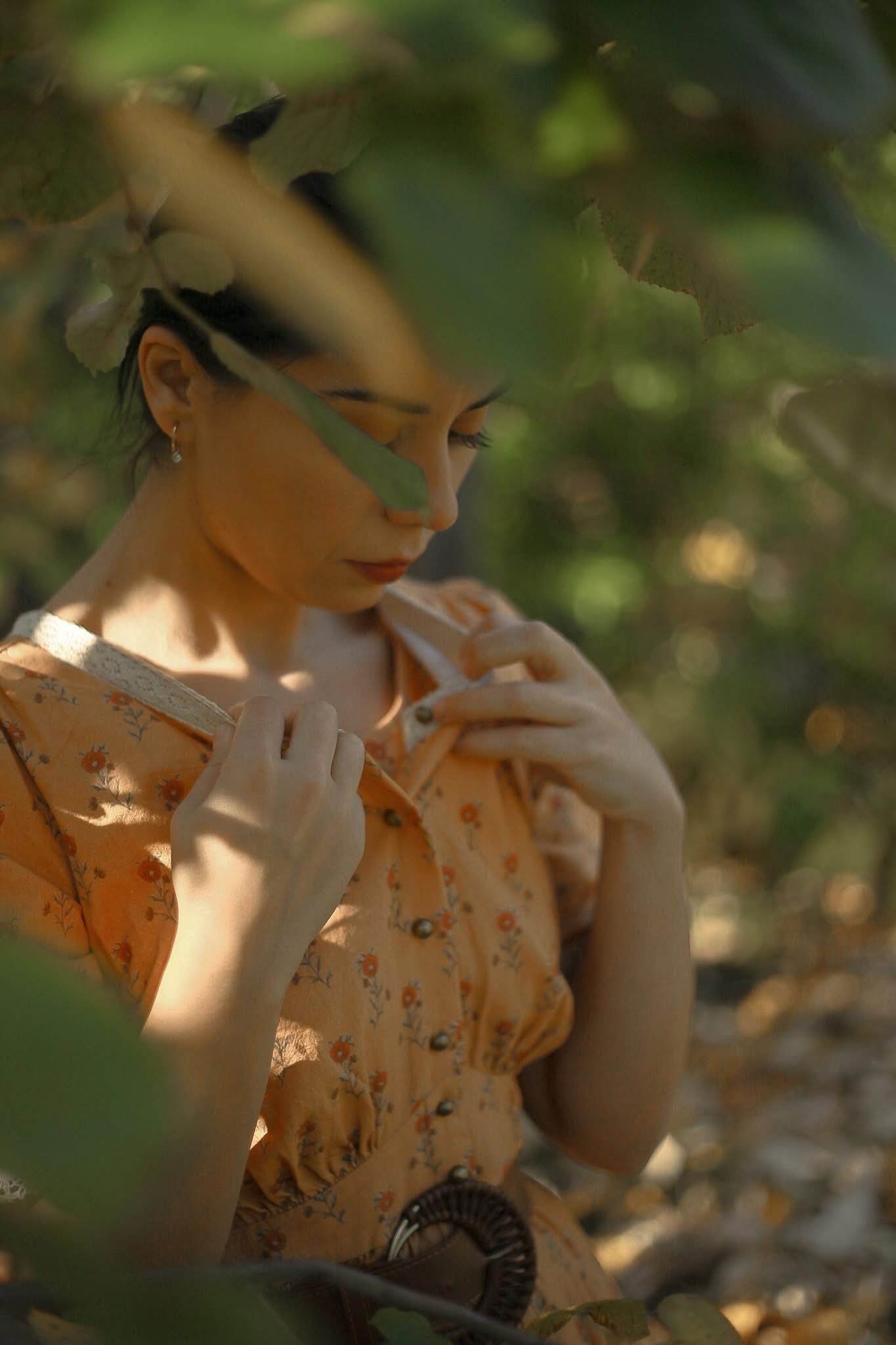 Woman in modest nursing dress among greenery