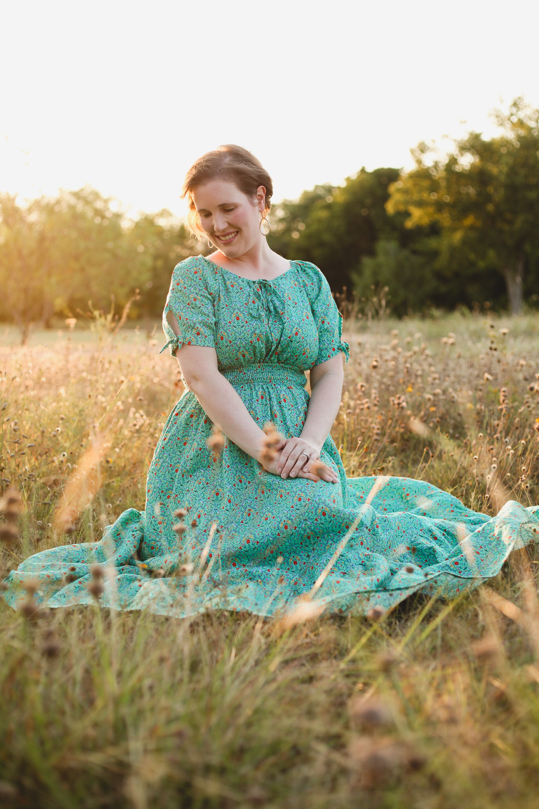 Woman in modest nursing green dress sitting