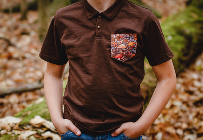 Boy wearing brown polo with colorful pocket