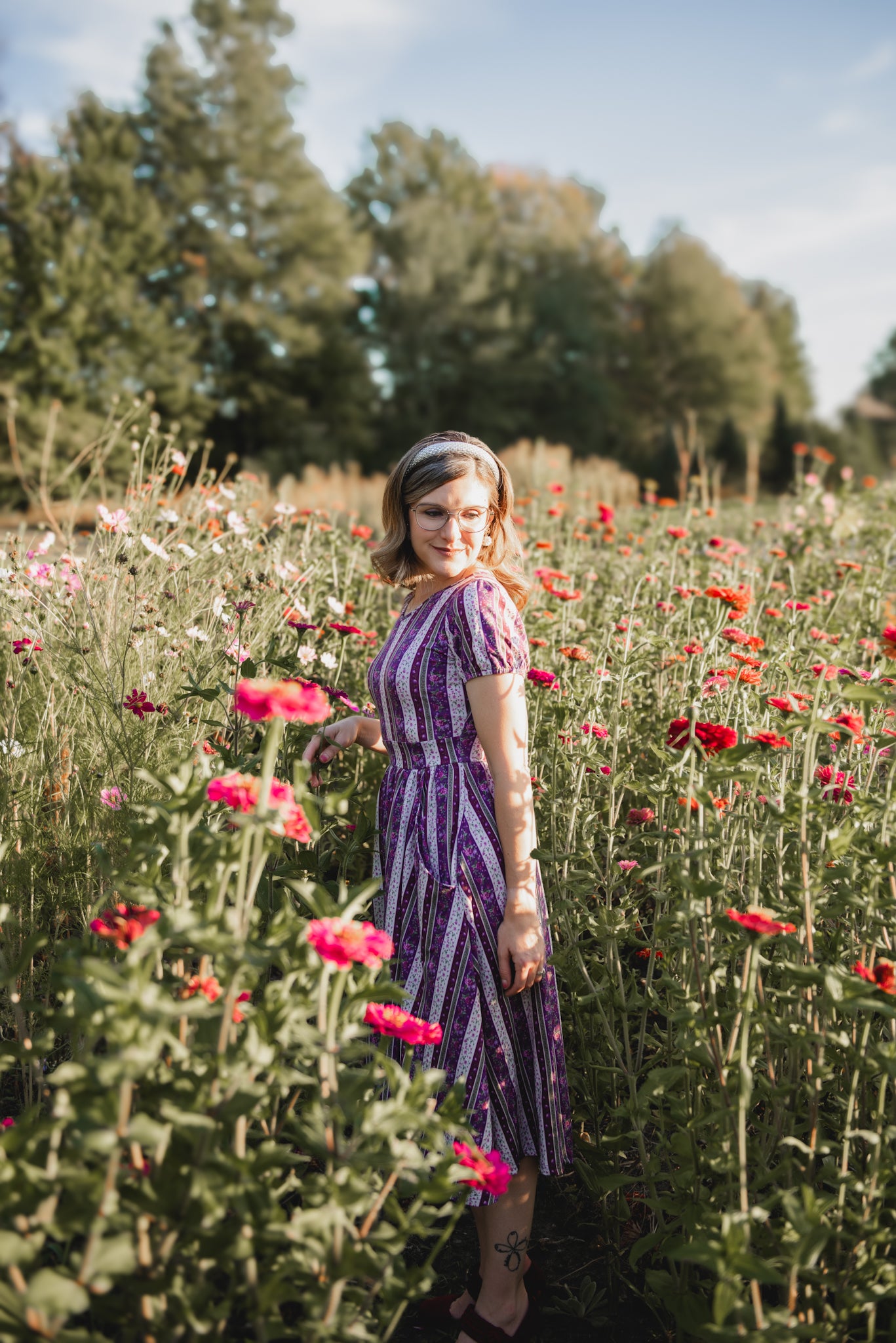 woman wearing a modest nursing purple and white striped dress