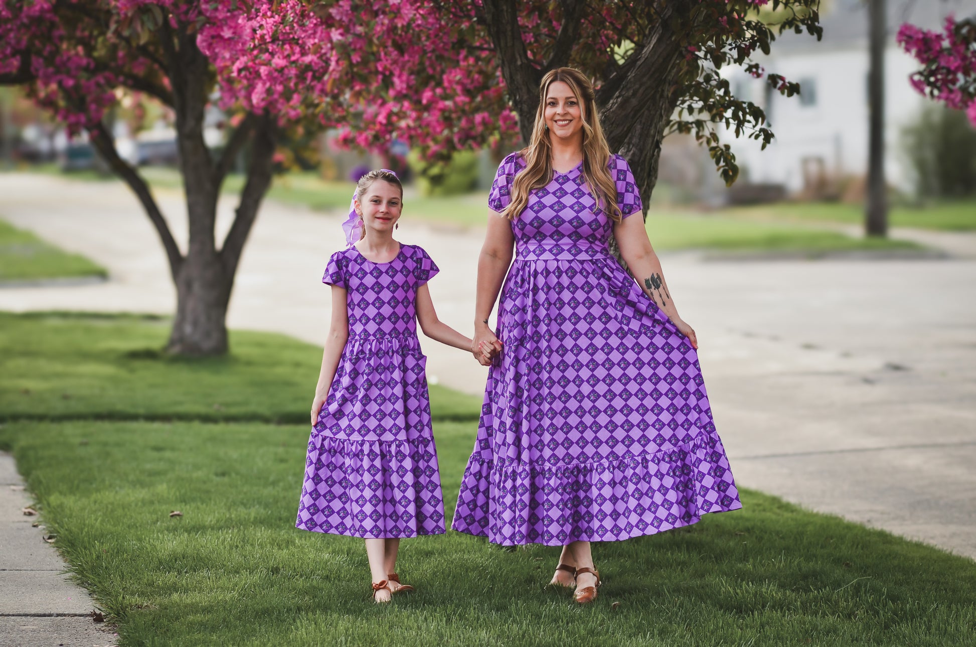 woman and daughter wearing purple modest dresses
