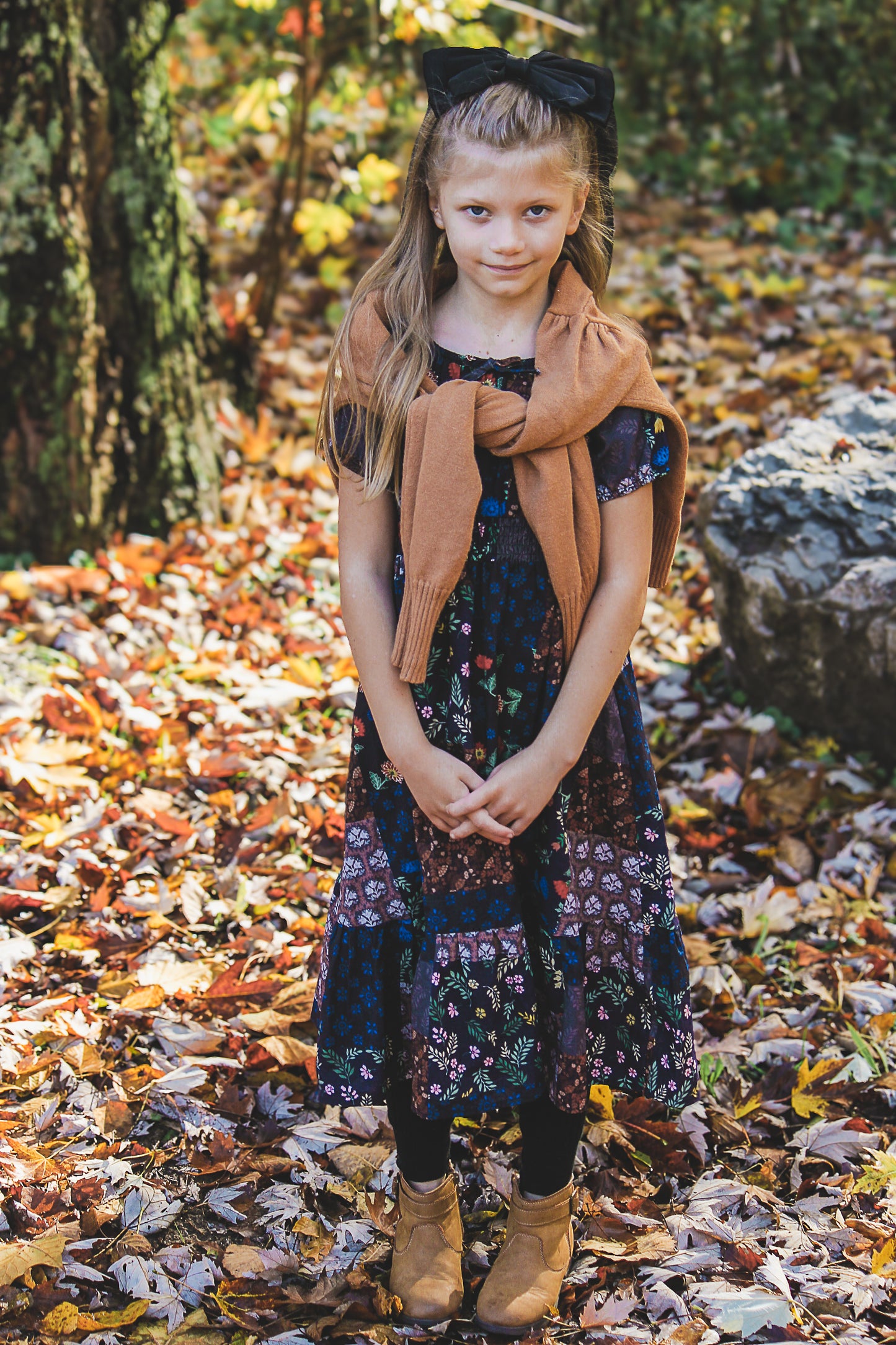 young girl wearing a cute patchwork dress