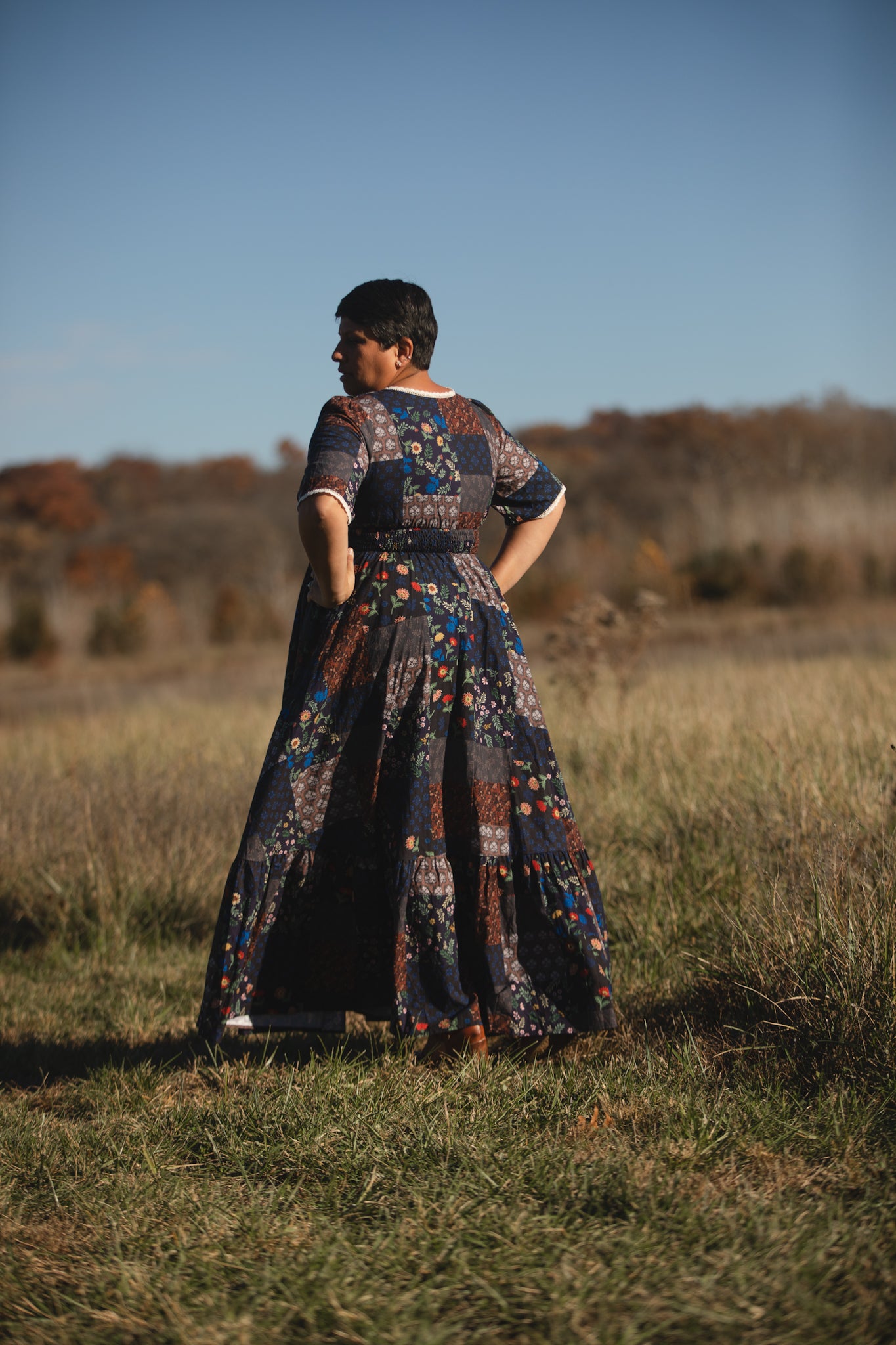 woman wearing a modest nursing patterned dress