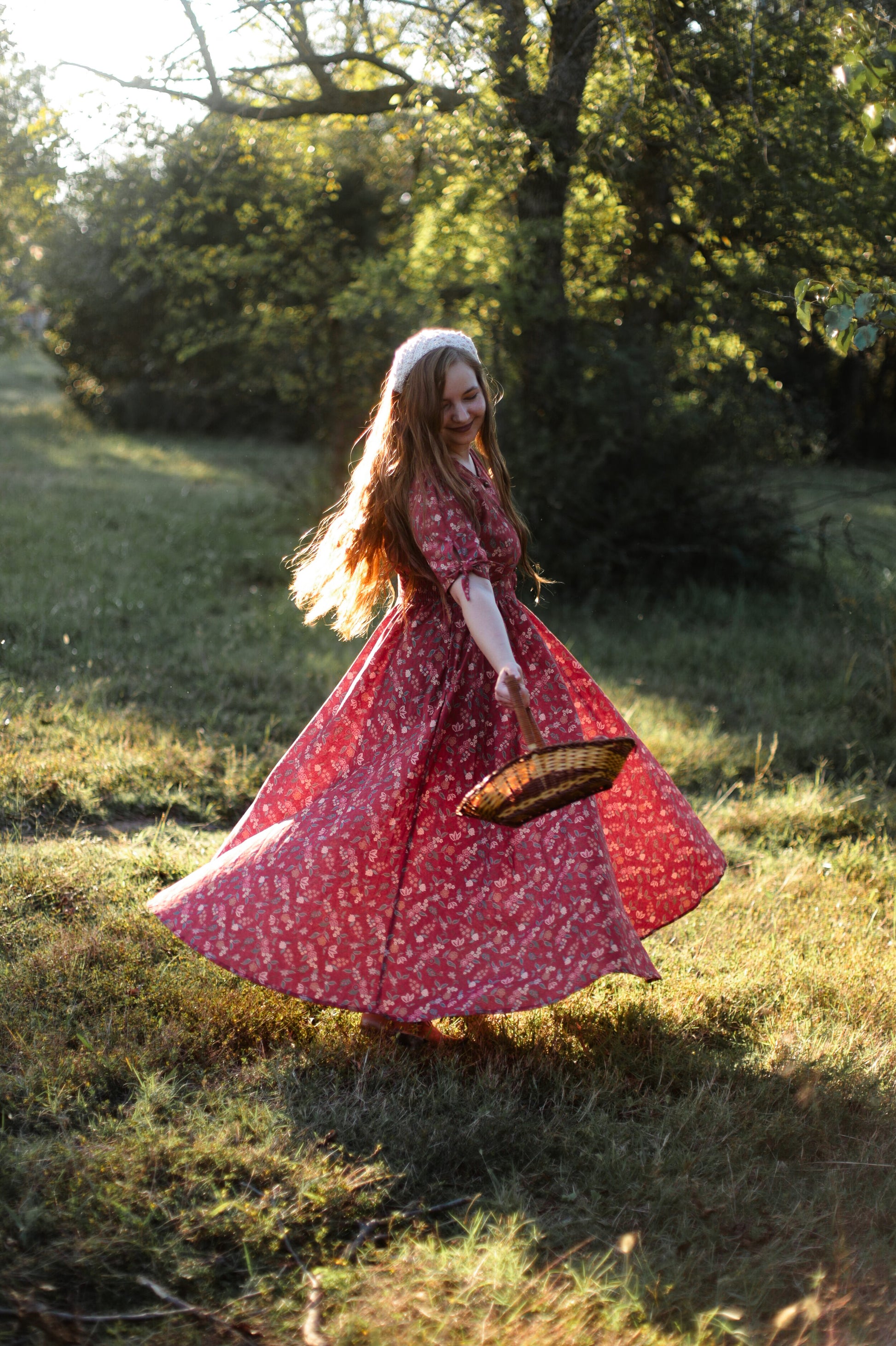 Woman in modest nursing red floral dress outdoors