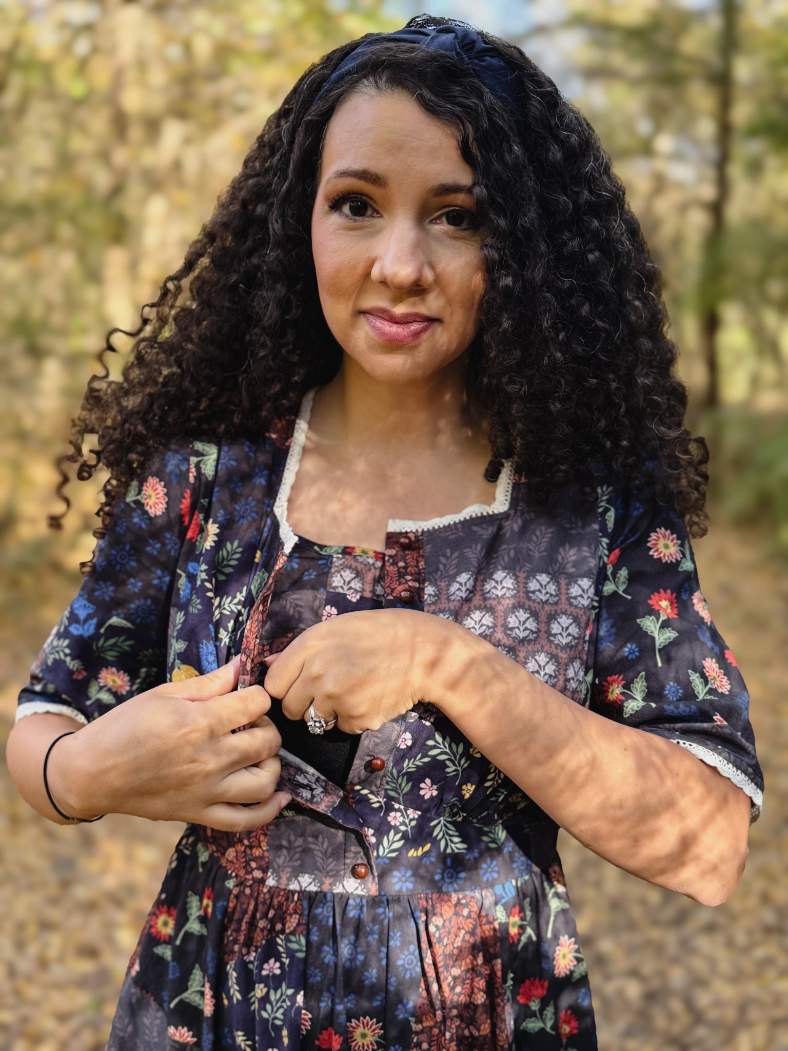 woman wearing a modest nursing patterned dress