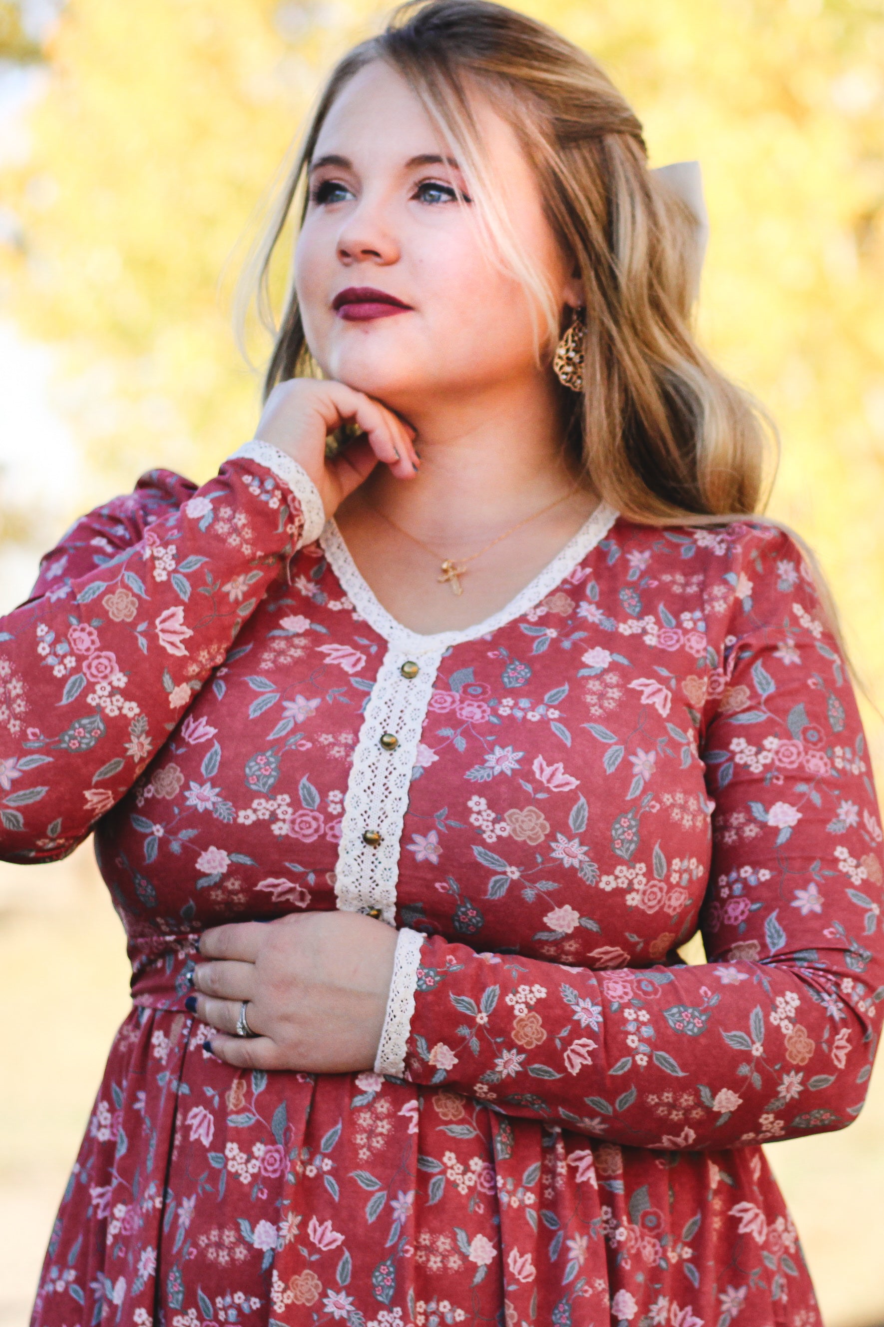 Woman in modest nursing red floral dress outdoors