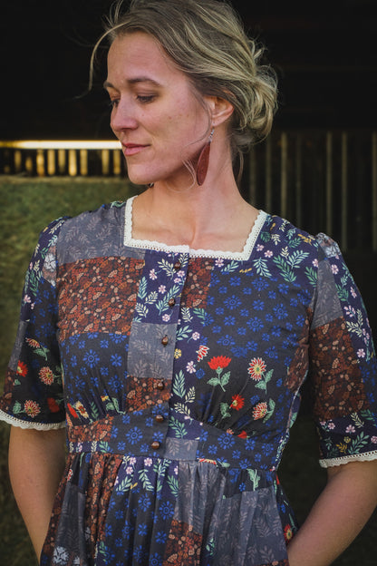 woman wearing a modest nursing patterned dress
