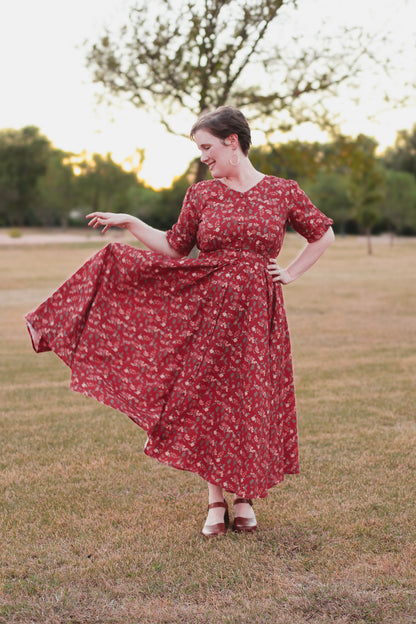 Woman in modest nursing red floral dress outdoors