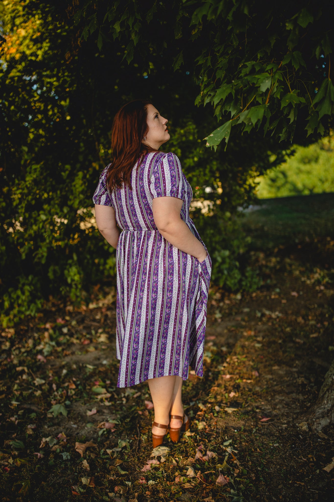woman wearing a modest nursing purple and white striped dress