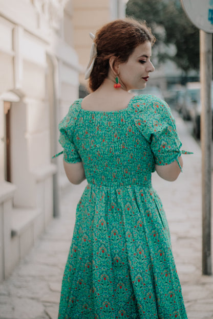 Woman in modest nursing green floral dress