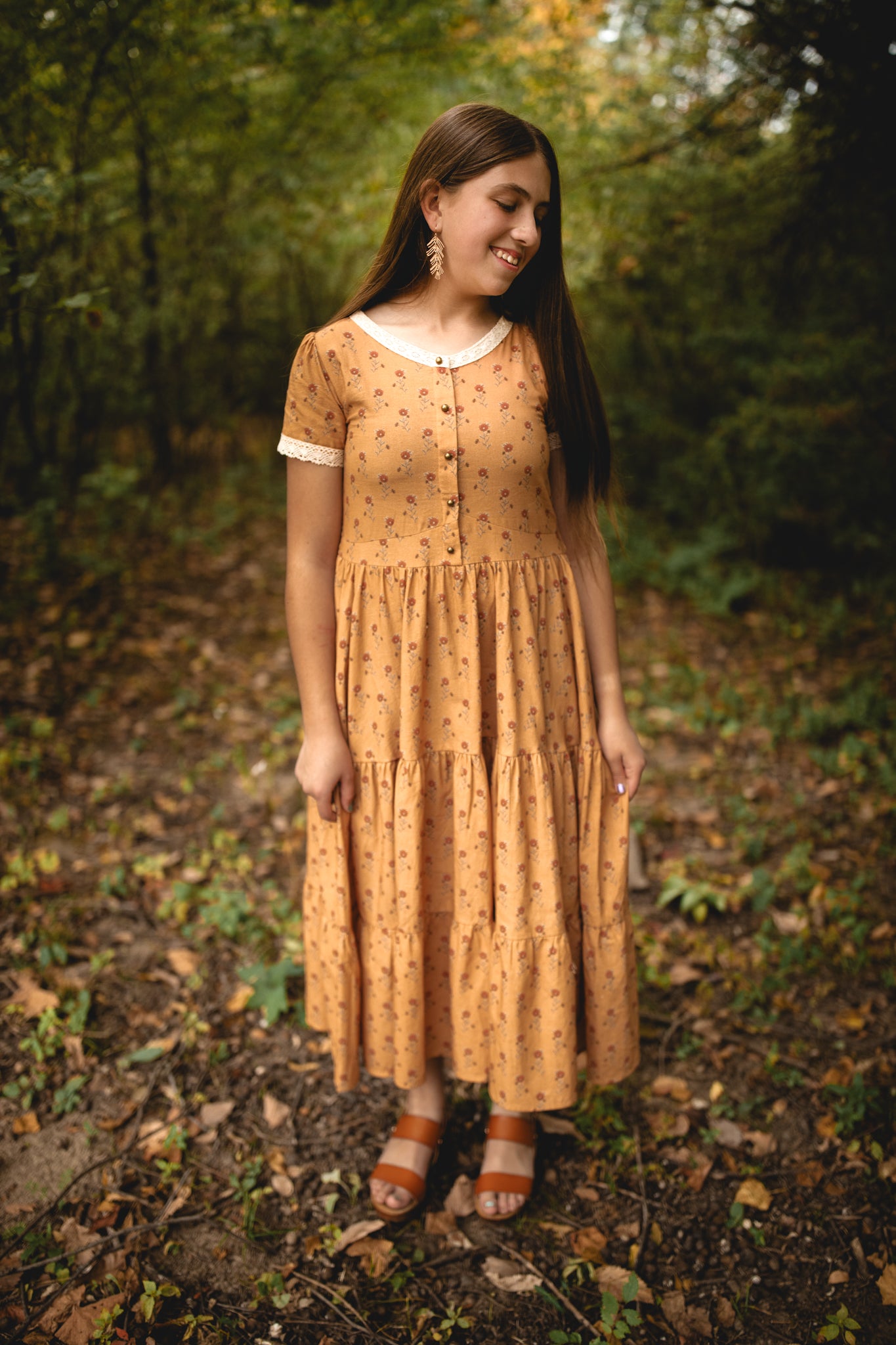 Woman in modest nursing dress in forest