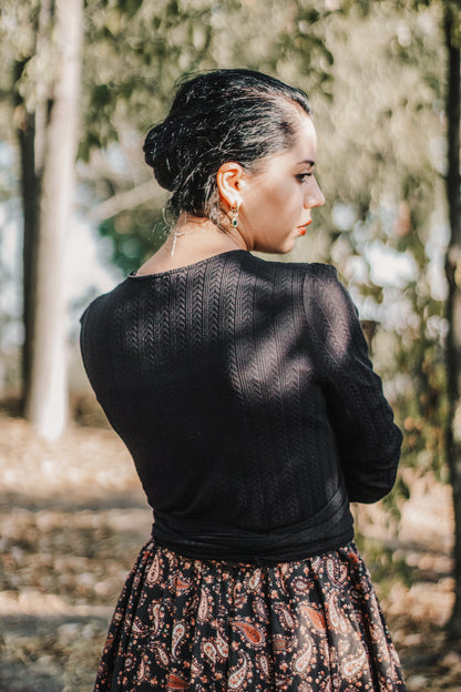 woman wearing a modest nursing black patterned dress