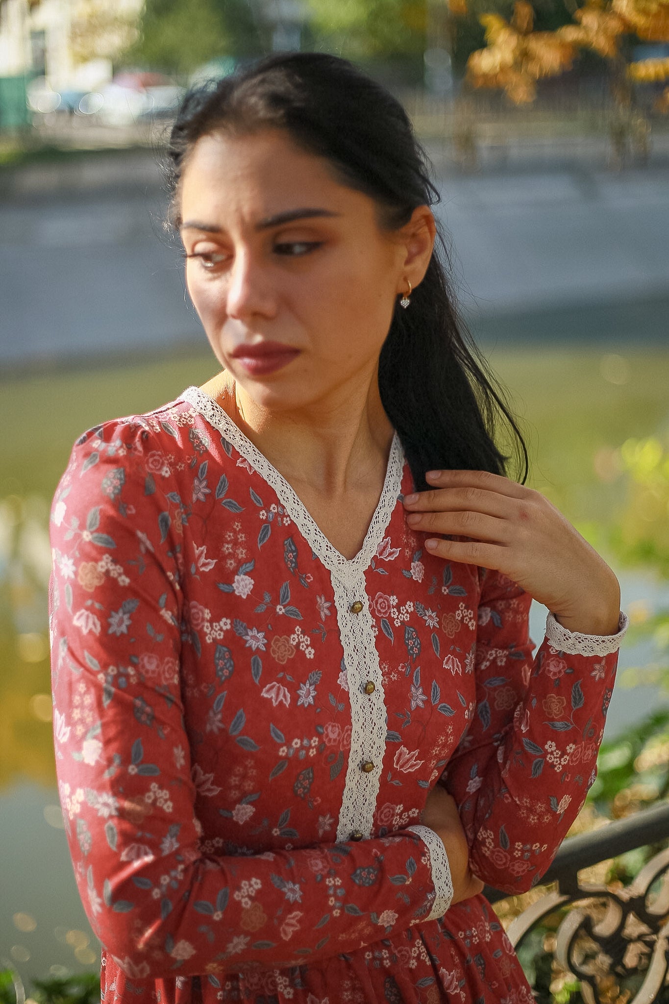 Woman in modest nursing red floral dress outdoors