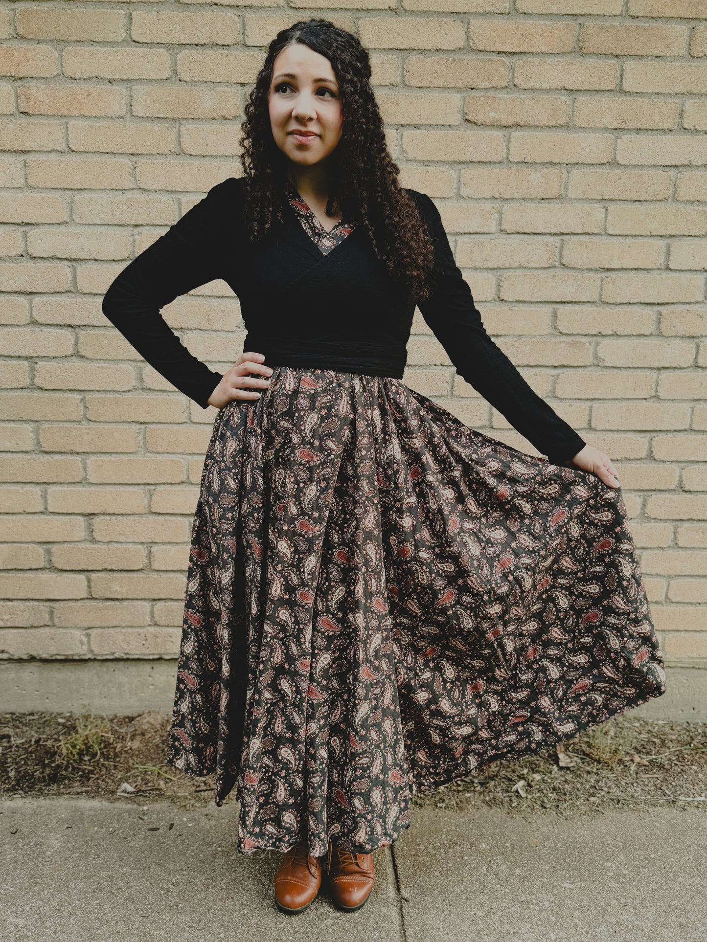 woman wearing a modest nursing black patterned dress