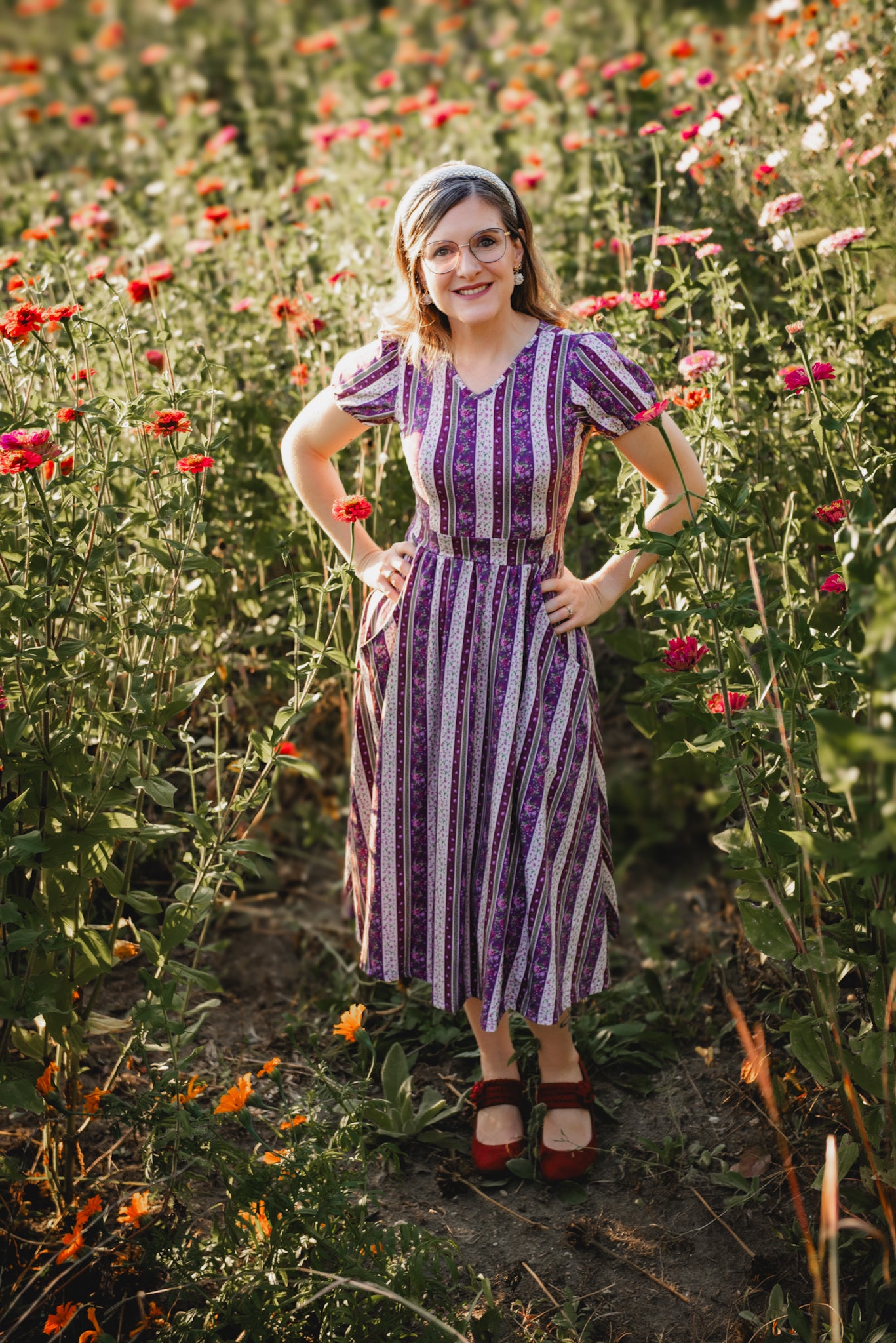 woman wearing a modest nursing purple and white striped dress