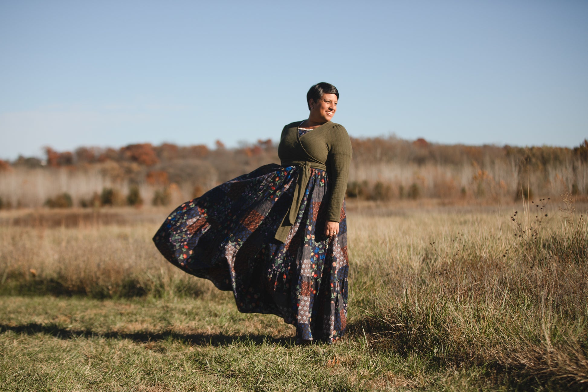 woman wearing a modest nursing patterned dress