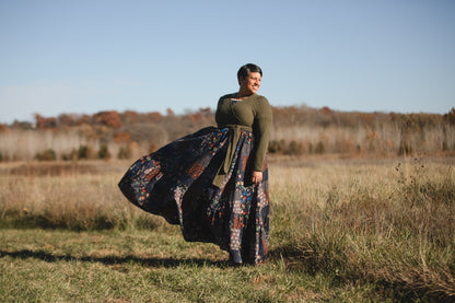 woman wearing a modest nursing patterned dress