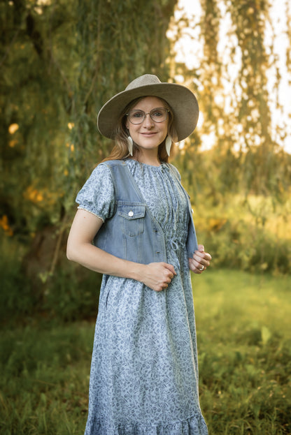 woman in a modest blue nursing dress