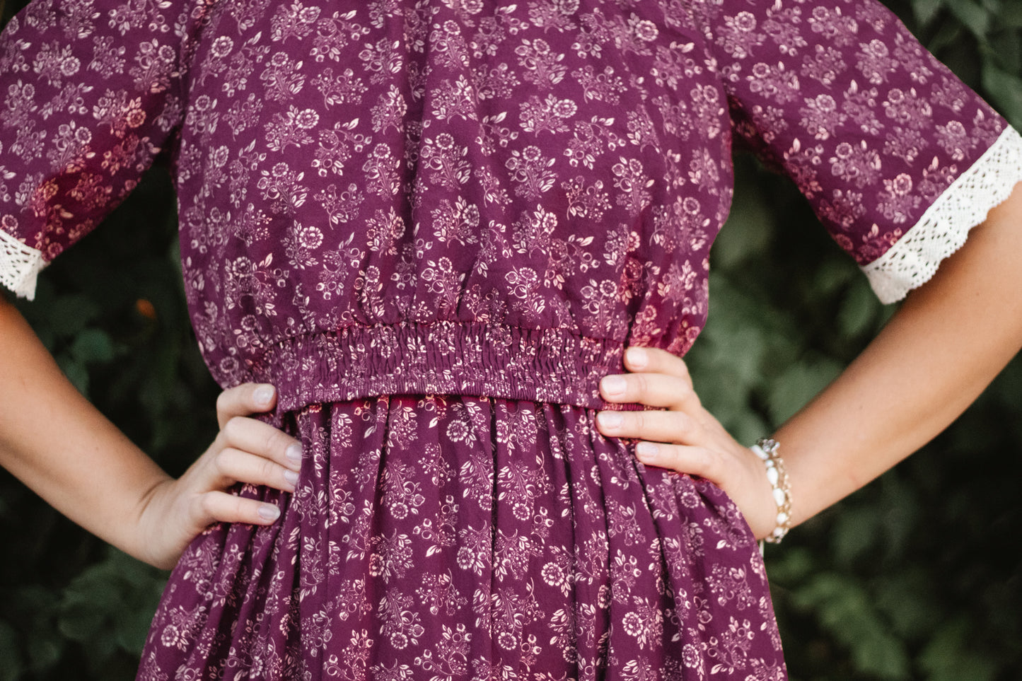 Woman in modest floral nursing dress outdoors