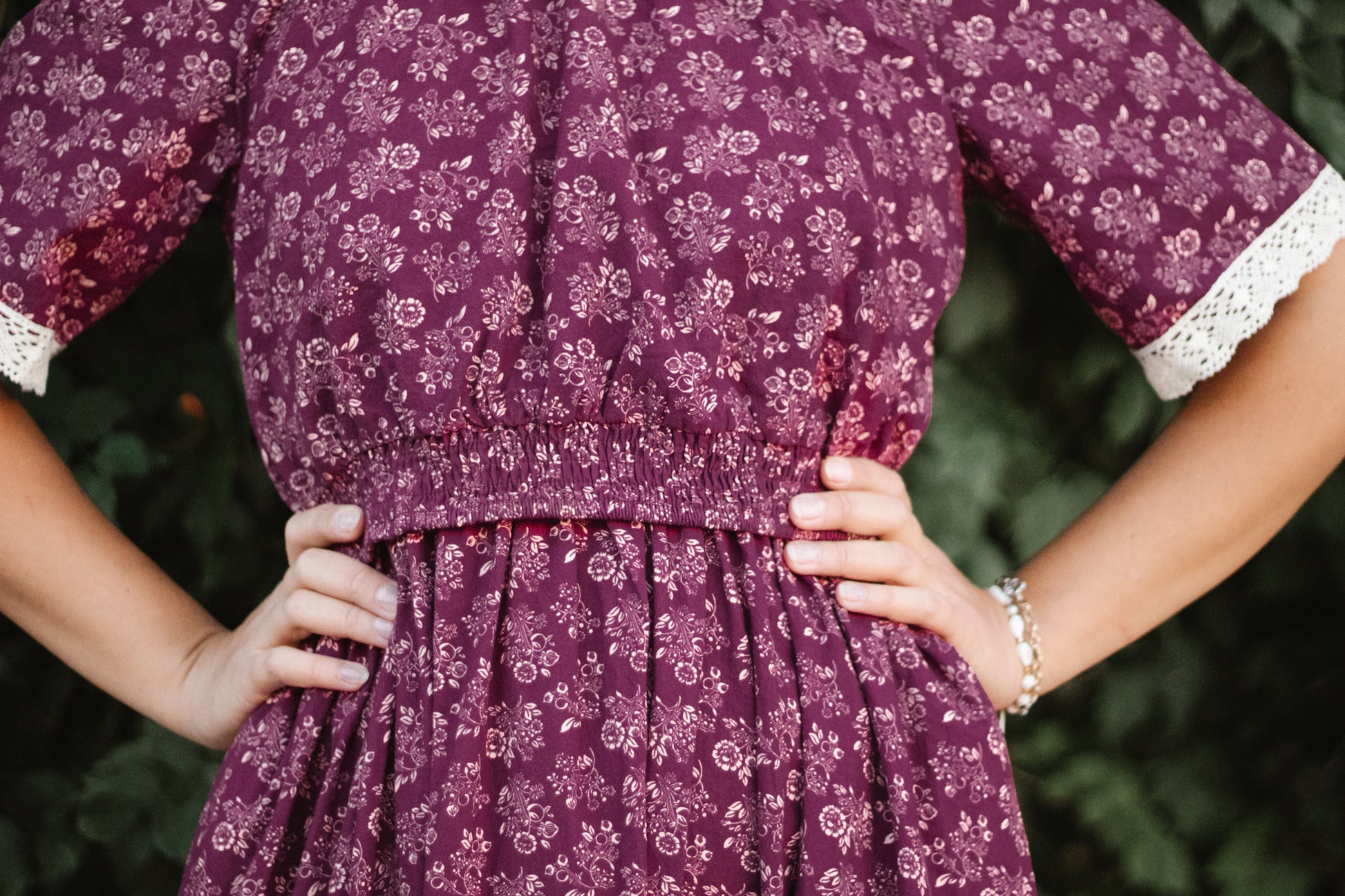 Woman in modest floral nursing dress outdoors