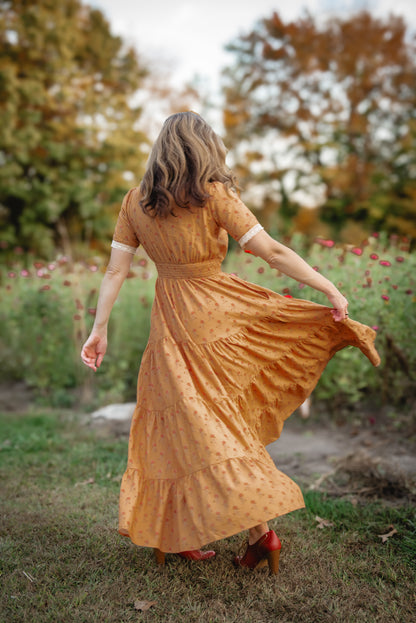 Woman in modest nursing dress outdoor setting