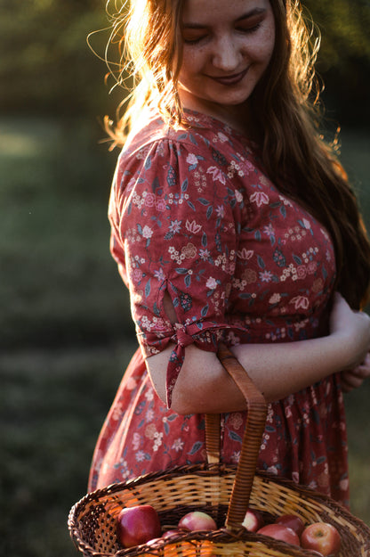 Woman in modest nursing dress with apple basket