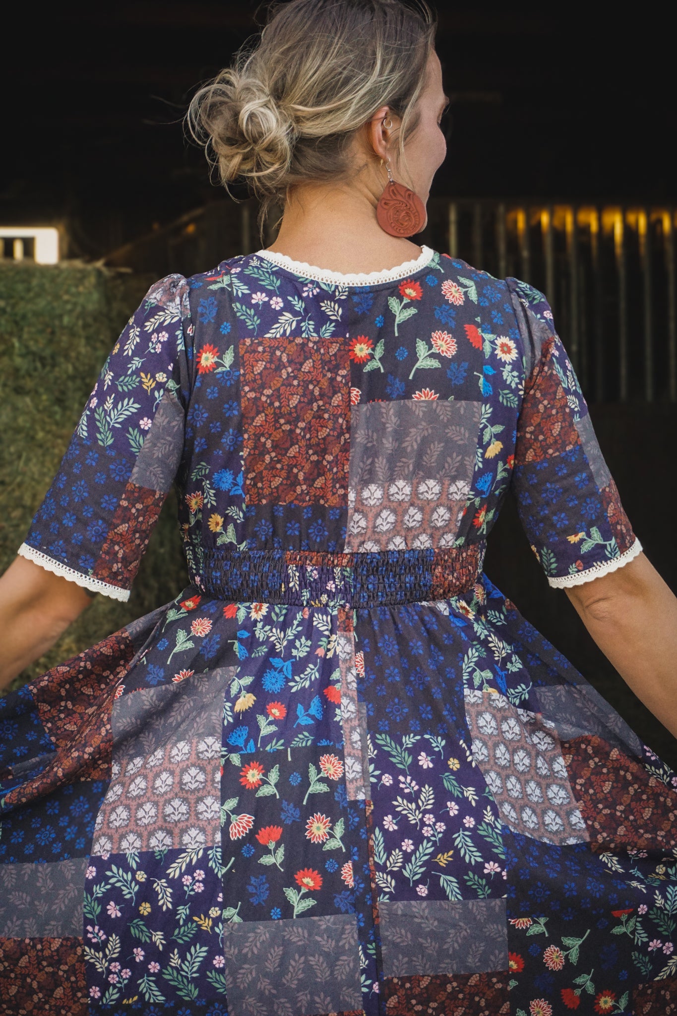 woman wearing a modest nursing patterned dress