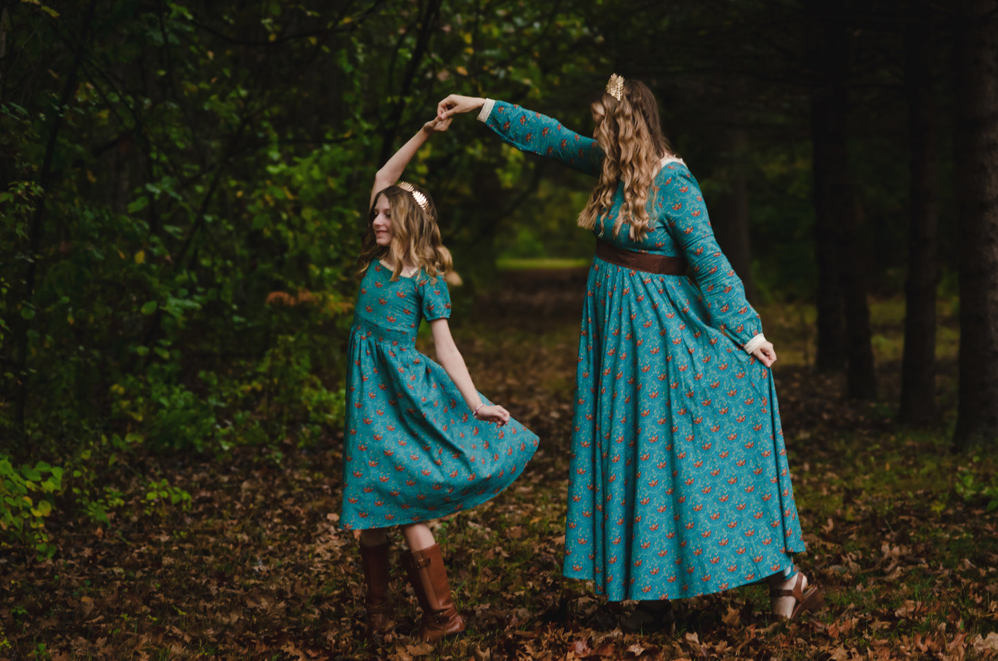 Two women wearing modest nursing dresses outdoors together