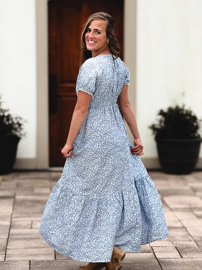 woman in a modest blue nursing dress