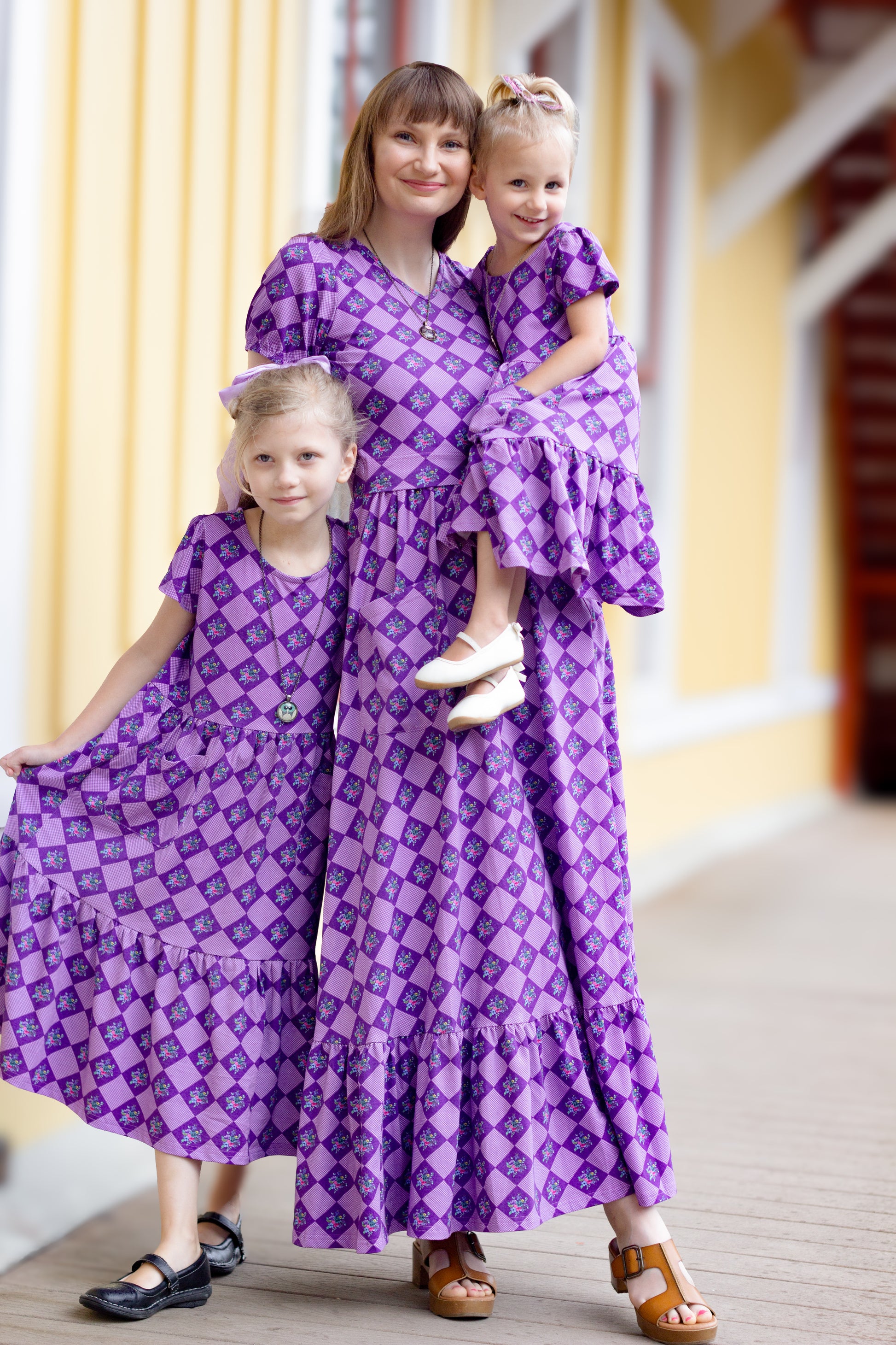 mother and daughters wearing modest dresses