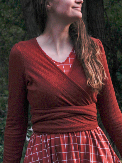Woman in modest nursing red plaid wrap dress