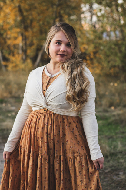 Woman in modest nursing dress in forest