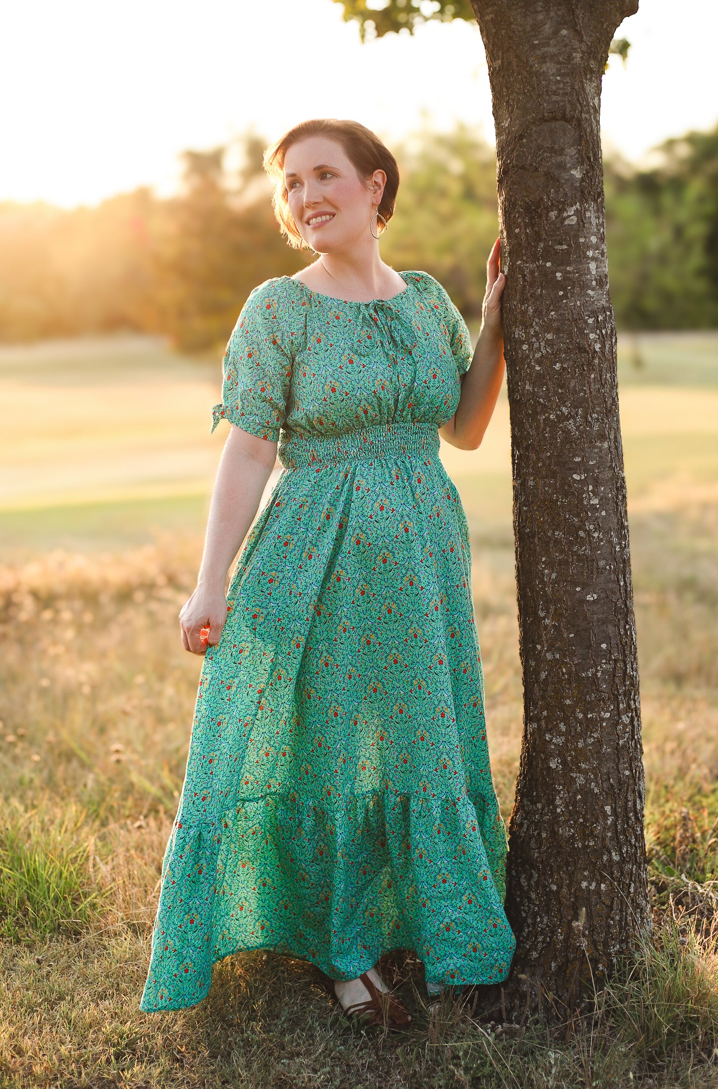 Woman in modest nursing green dress outdoors