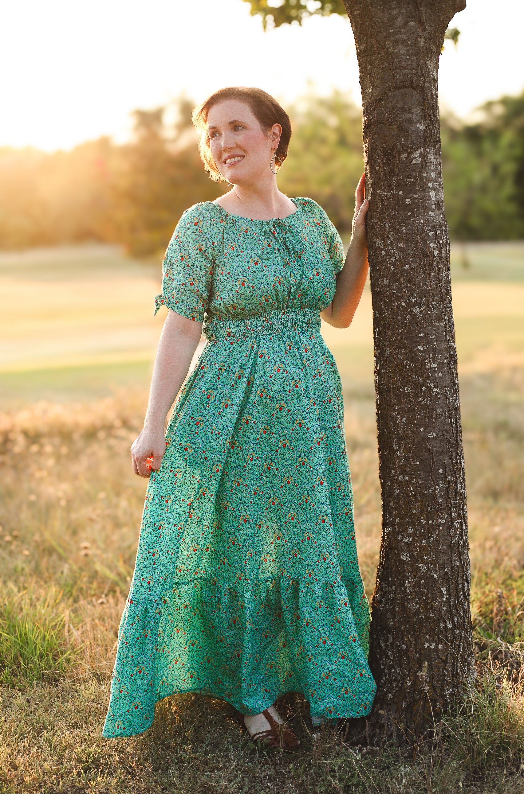 Woman in modest nursing green dress outdoors