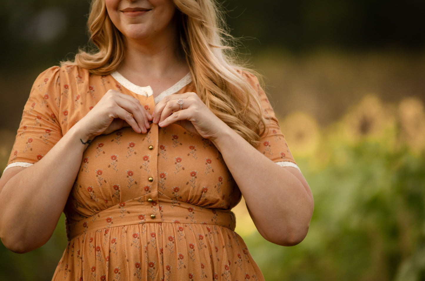 Woman in modest nursing dress in field
