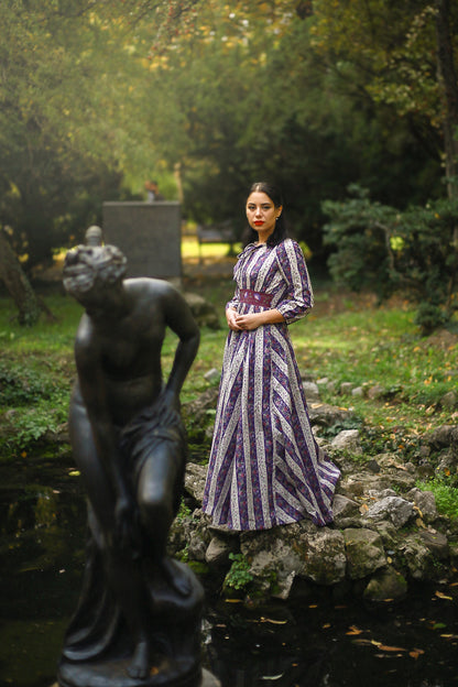 Woman in modest nursing dress in garden