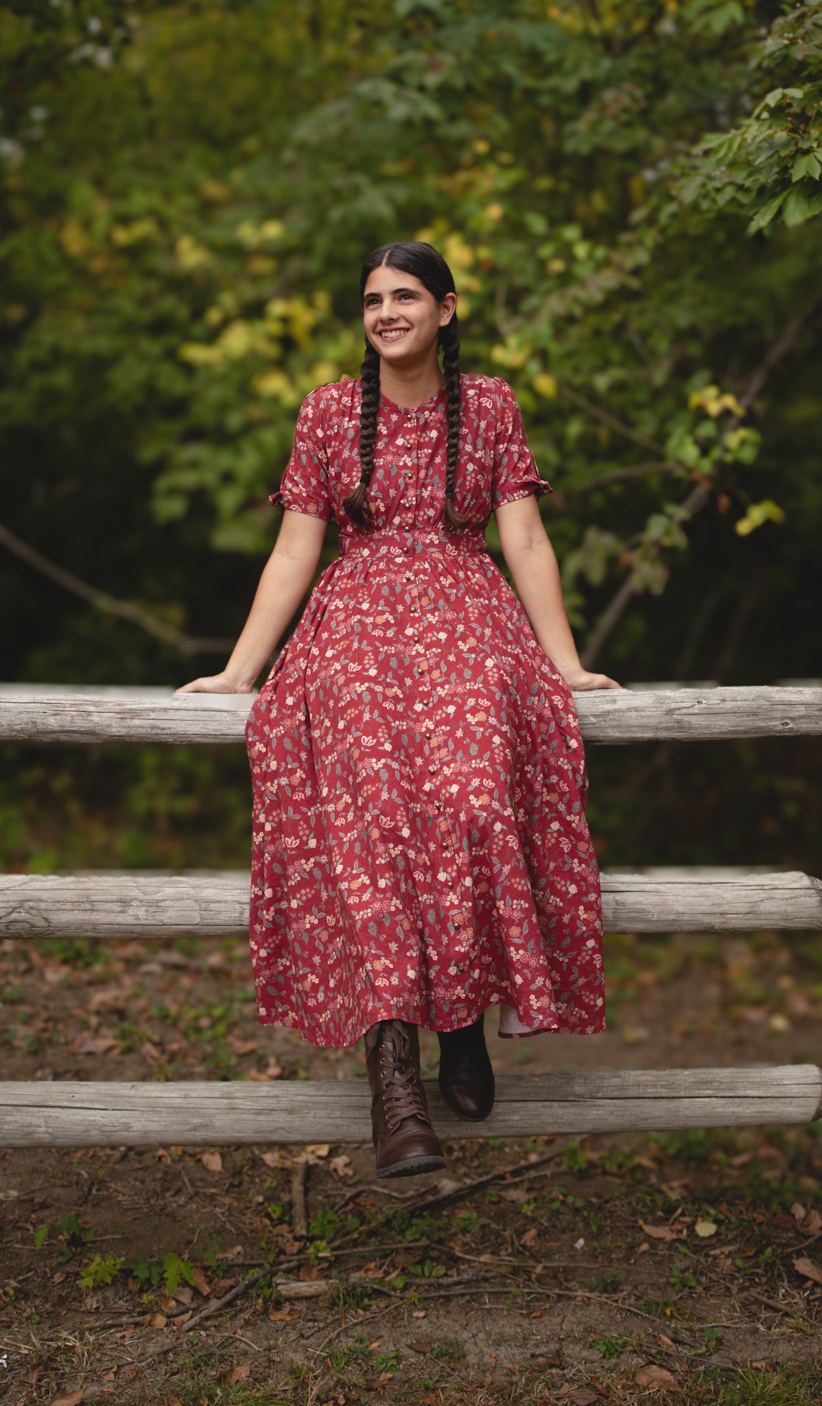 Woman in modest nursing red floral dress outdoors