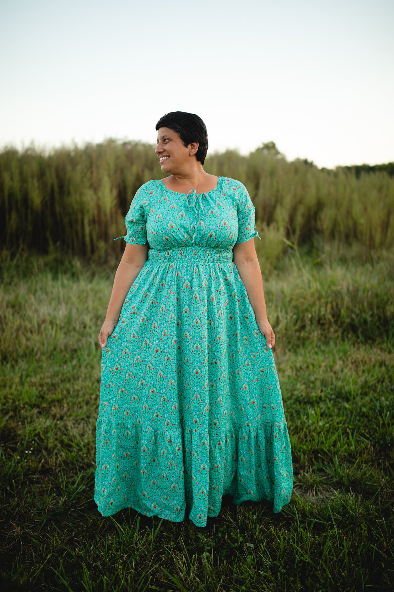 Woman in modest nursing teal dress outdoors