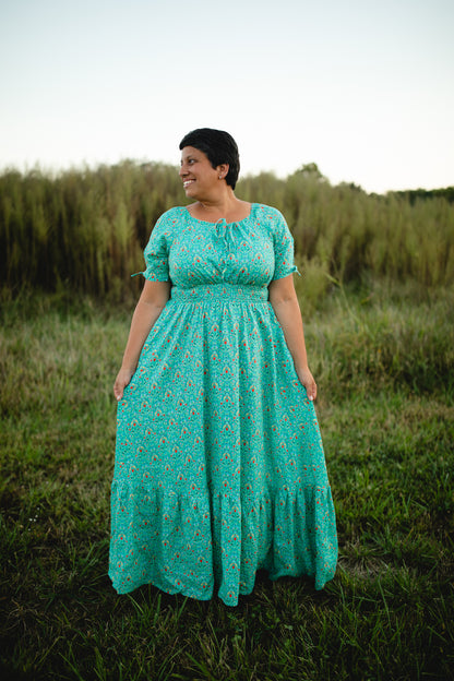 Woman in modest nursing teal dress outdoors