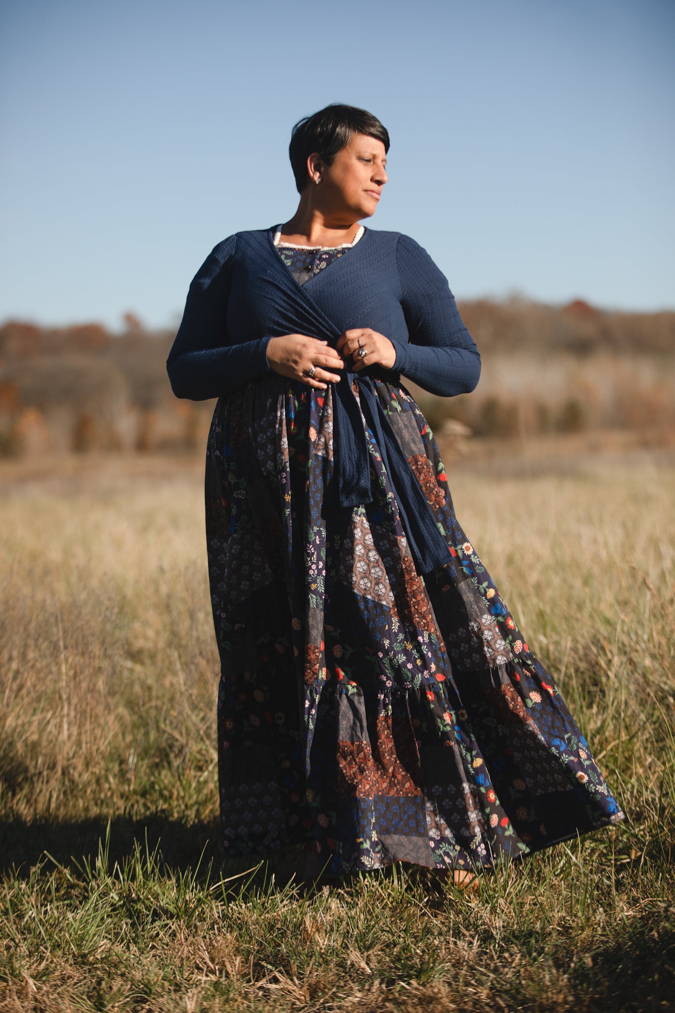 woman wearing a modest nursing patterned dress