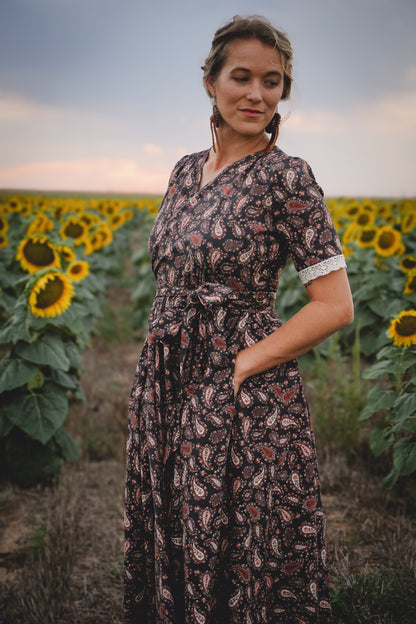 woman wearing a modest nursing black dress